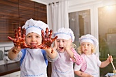 Germany, Boy hands covered with chocolate dough