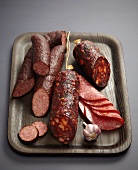 Assorted sausages and salamis on a tray