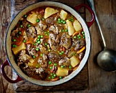 Rustic lamb casserole with fresh peas