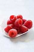 Fresh raspberries in a paper baking cup