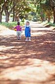 Two children playing on a path