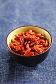 Dried chilli peppers in a small bowl