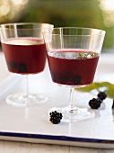 Two Blackberry Cocktails on a White Tray