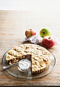 Apple tart with cream, with a large slice removed