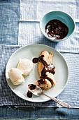 Banana split with chocolate sauce and vanilla ice cream