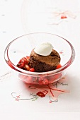A miniature chocolate cake with berry compote