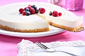 Cheesecake with berries, a piece removed
