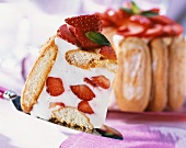 Strawberry charlotte, one slice on a cake slice