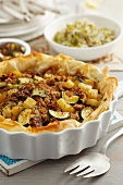 Beef with courgette and potatoes in a filo pastry crust