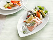 Salmon fillet with asparagus and herb sauce