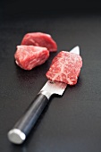 Wagyu beef on a knife blade