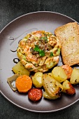 Salmon burger with pan-fried vegetables and toast