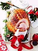 Glazed roast ham with cloves and figs