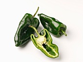 Poblano chilli peppers, whole and halved