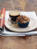 Chocolate crumble cupcake with a cup of coffee