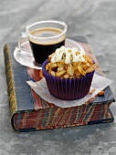 A florentine cupcake with a cup of coffee