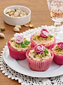 White chocolate cupcakes with strawberries and pistachios