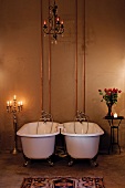Antique bathtubs in candlelight