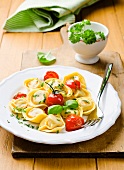 Tortellini with tomatoes, basil and parsley