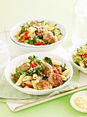 Penne with meatballs, rocket and tomatoes