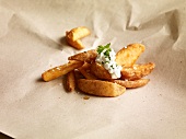 Potato wedges topped with herb dip