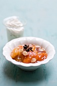 A compote of dried apricots, star anise and slivered almonds