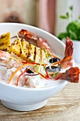 Grilled prawns and pineapple with coconut sauce