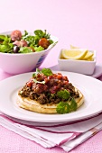 Savoury pancakes with minced meat and a side salad