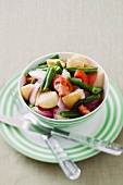 Vegetable salad with potatoes, beans, tomatoes and onions