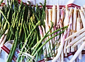 Green and white asparagus on a tea towel