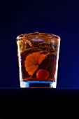 An Old Fashioned Cocktail with an Orange Slice and a Cherry
