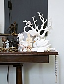 Ornaments from various cultures on console table