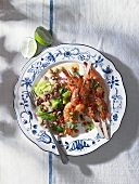 Grilled prawn skewers with a bean salad