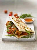 Flatbread with chicken, cherry tomatoes and rocket