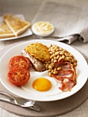 English breakfast with fried egg, bacon and baked beans
