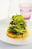 Fresh lettuce leaves on tabbouleh