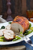 Roasted turkey joint, partly sliced, with savoy cabbage