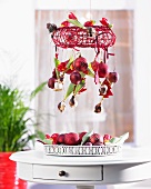 Christmas mobile with red tulips, apples and baubles