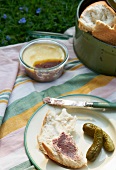 A baguette with liver pâté and gherkins