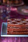 A layer cake with chocolate cream