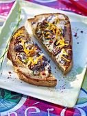 Bread topped with morel mushrooms and orange zest