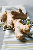 Pieces of fresh root ginger on a cloth