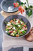 Grilled asparagus salad with Chevin cheese, ham and croutons