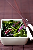 Wakame salad with limes, red onions and sesame seeds