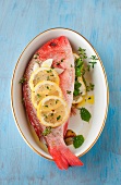 Whole Red Snapper with Fresh Herbs and Lemon; In a Bowl; From Above