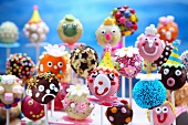 Colourful and humorously decorated cake pops