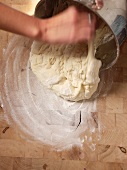 Making Bread; Dumping Dough from Pan onto Floured Surface