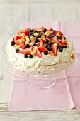 Pavlova with strawberries and blueberries