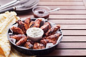 Grilled chicken wings with a dip