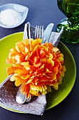 Homemade paper flowers as a napkin ring